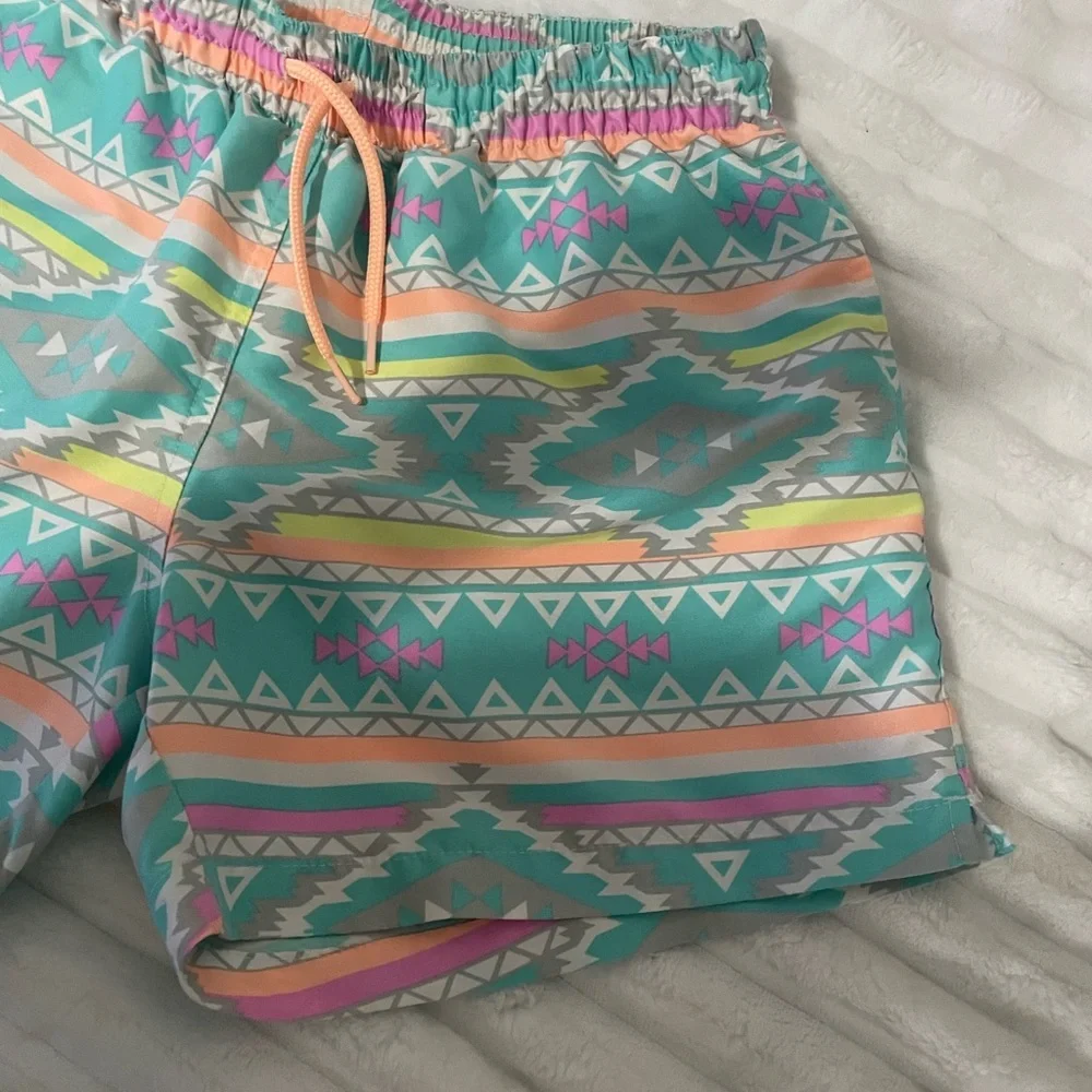 chubbies Turquoise Aztec Swim Trunks with Pink and Yellow Accents